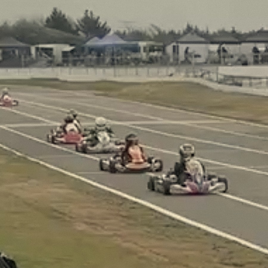 Pack running down the back straight