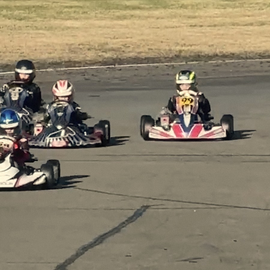 Number 99 running wide of the pack out of the corner